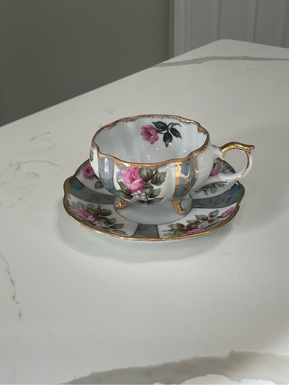 Porcelain Tea Cup and Saucer with Pink Rose Motif and Gold Trim